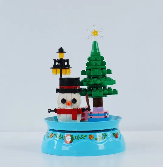 Woma Toys Commercio all'ingrosso Personalizza Bambini Regali di compleanno di Natale Modello di pupazzo di neve da collezione Spin Music Box Fai da te Piccoli blocchi di mattoni Set Giocattolo di gioco fai da te